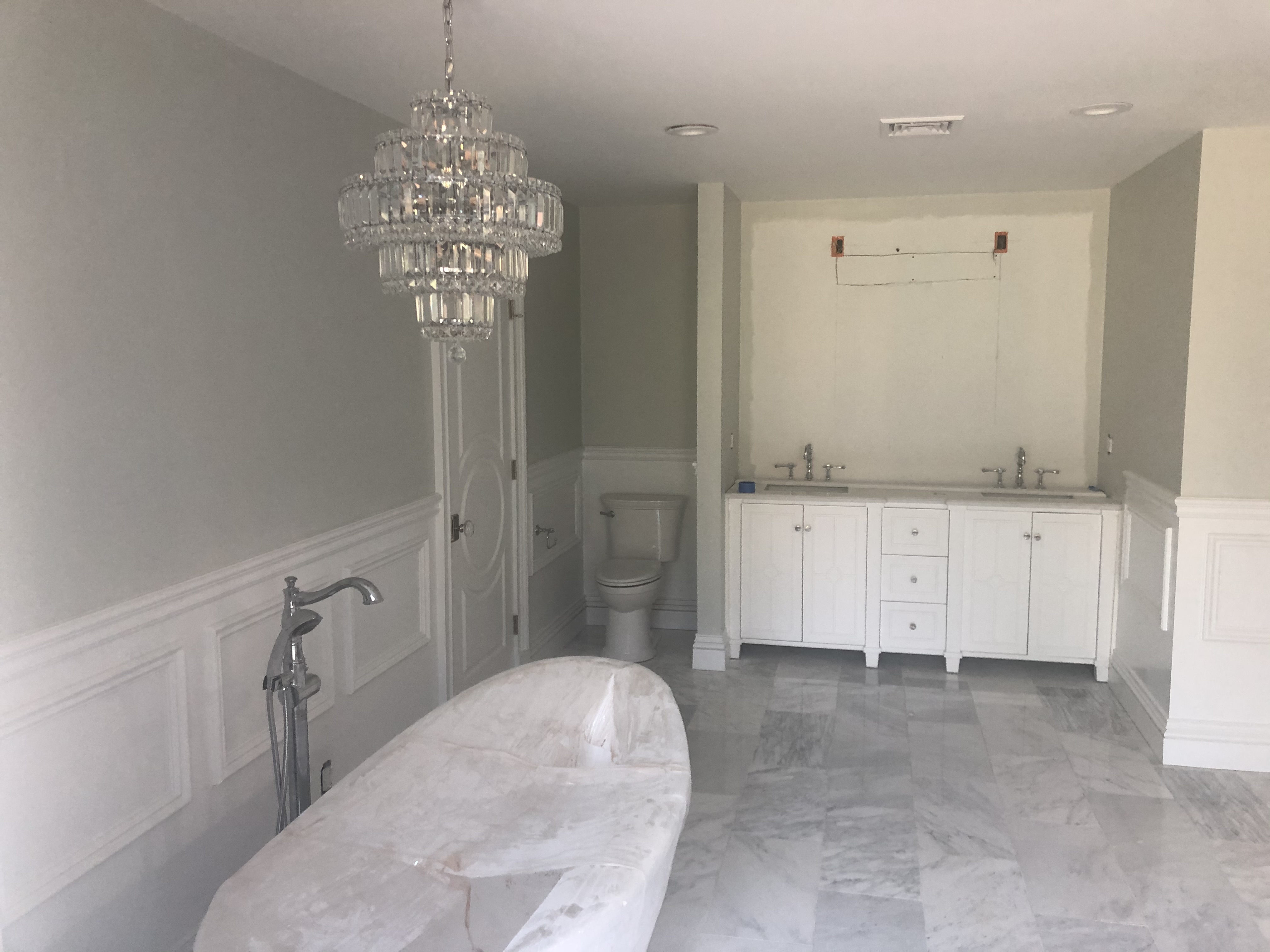 Bathroom vanity and cabinetry in a bright bathroom